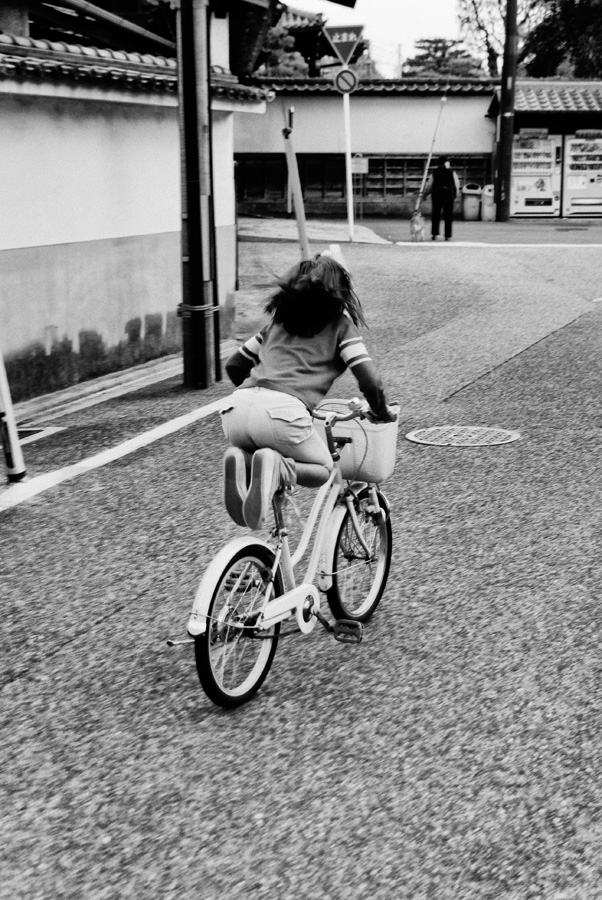 Kyoto – Girl riding a bicycle