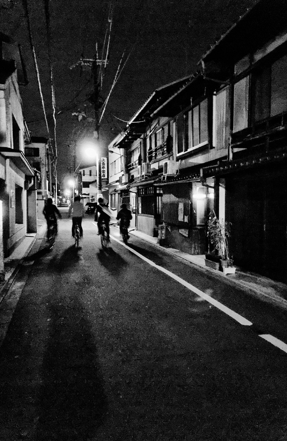 Kyoto – A group of bicycle drivers at night